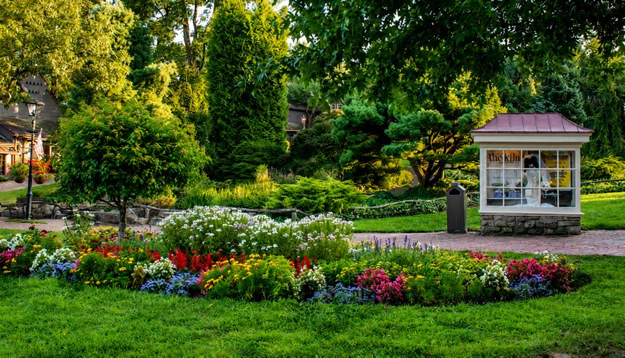 The Kiln shop framed by garden beds at Peddler’s Village