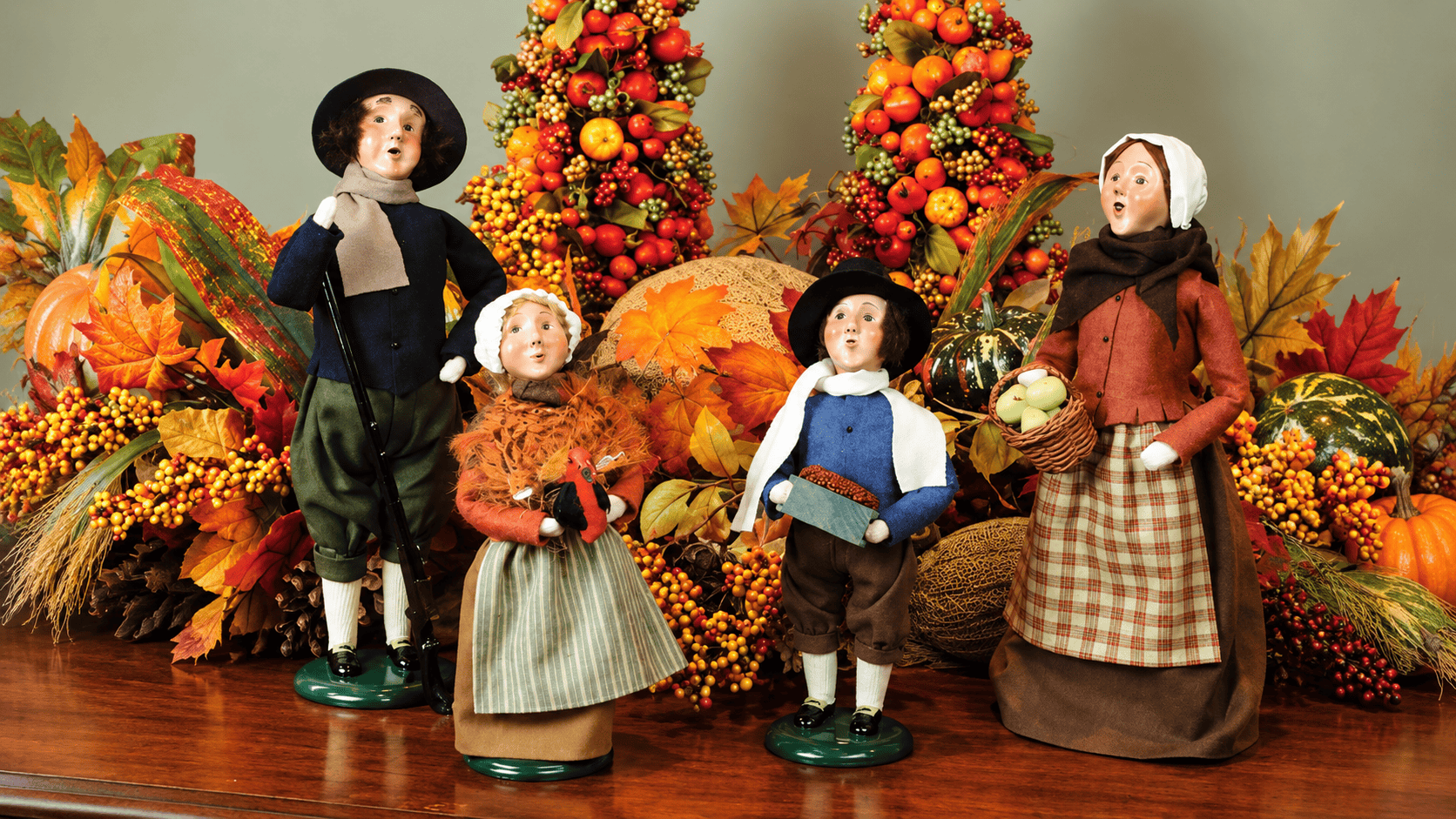 Artisans handcrafting Carolers in the Byers' Choice workshop